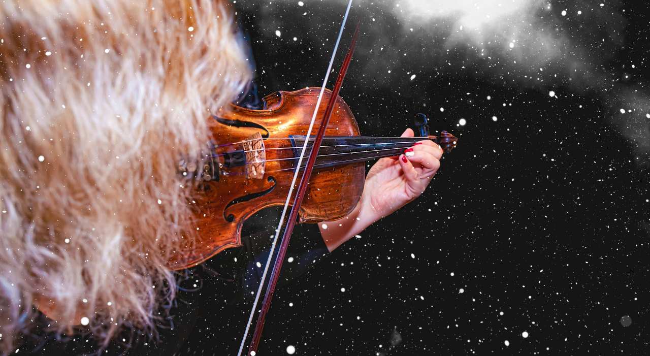 How to rosin a bow - blond hair playing violin in snowy background