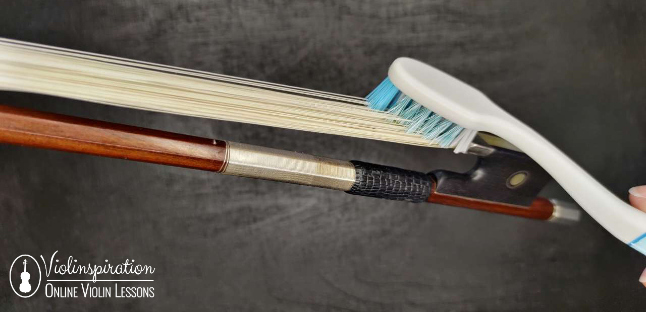 how to clean violin strings - cleaning bow hair with a toothbrush