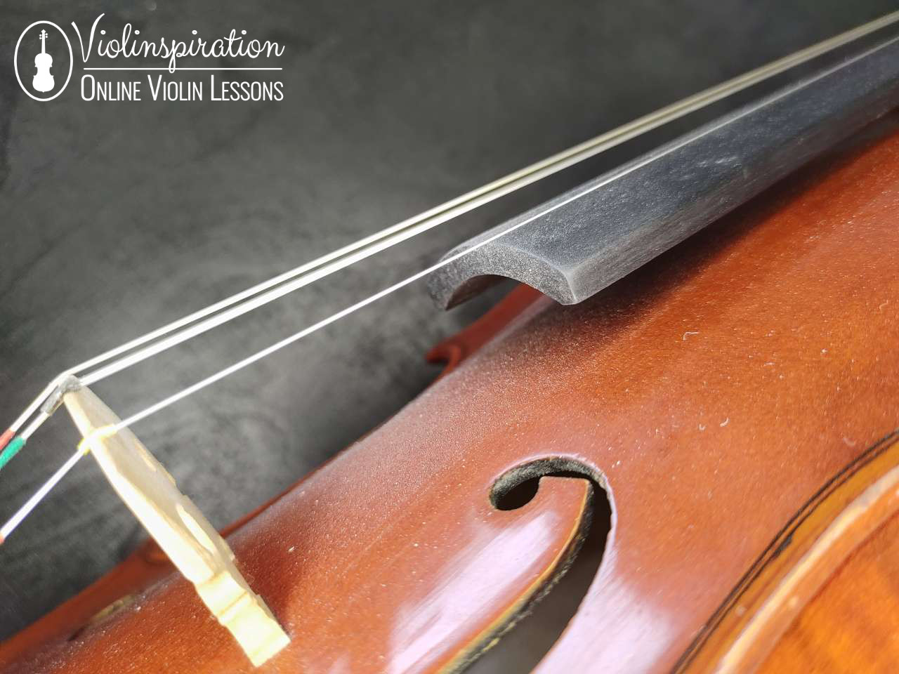 how to clean violin strings - violin close-up with rosin dust